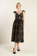 A woven black lace midi dress featuring sweetheart neckline, ruffled shoulder, full skirt and back zipper closure