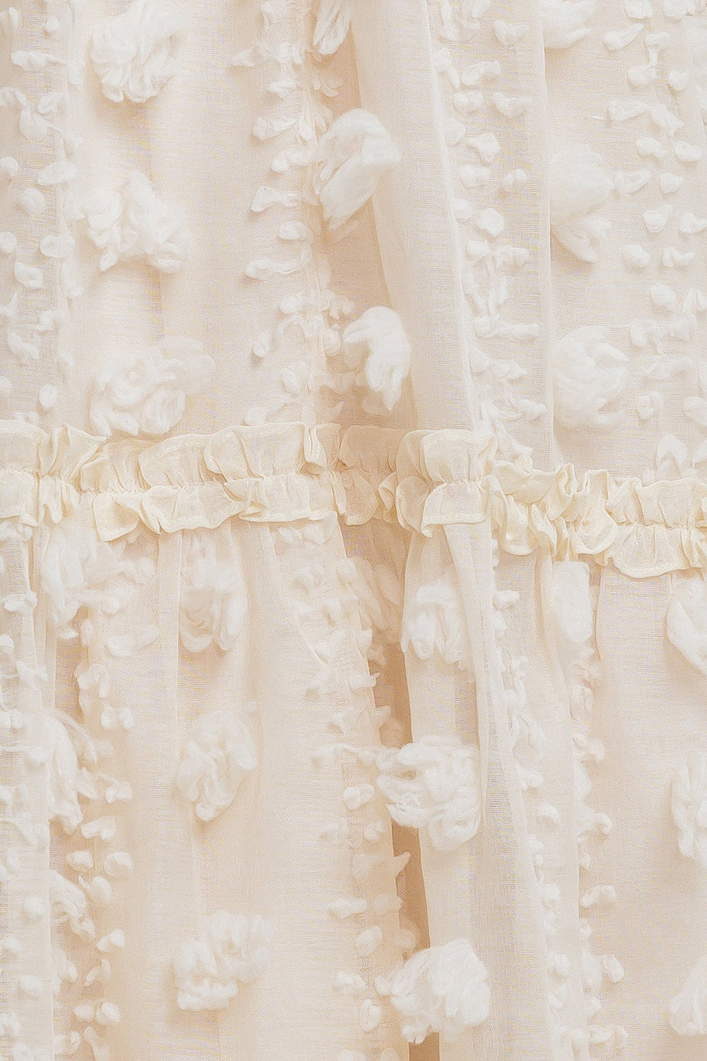 A cream textured woven ankle dress featuring ruffled cross front and tiered skirt