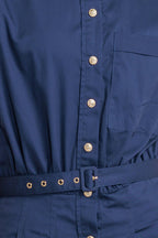 A solid woven midi dress featuring collar, short sleeve, front pocket, button down, self-belt and full skirt