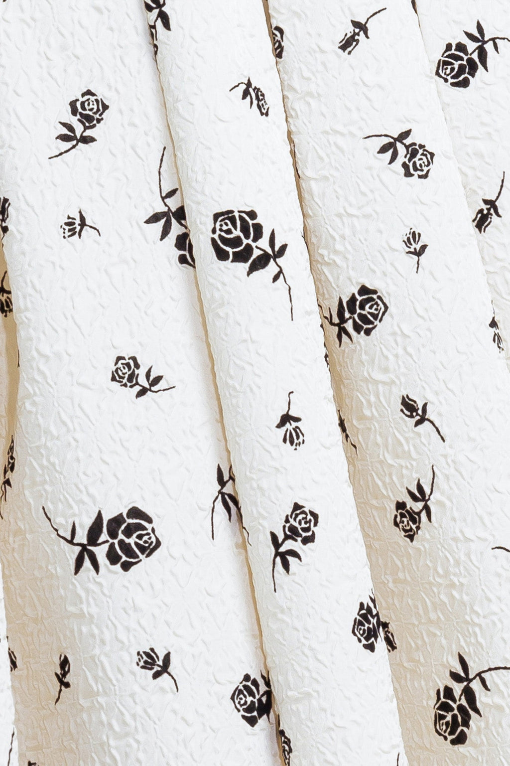 A printed textured woven midi dress featuring strapless neckline, contrasting belt, full skirt and back zipper closure