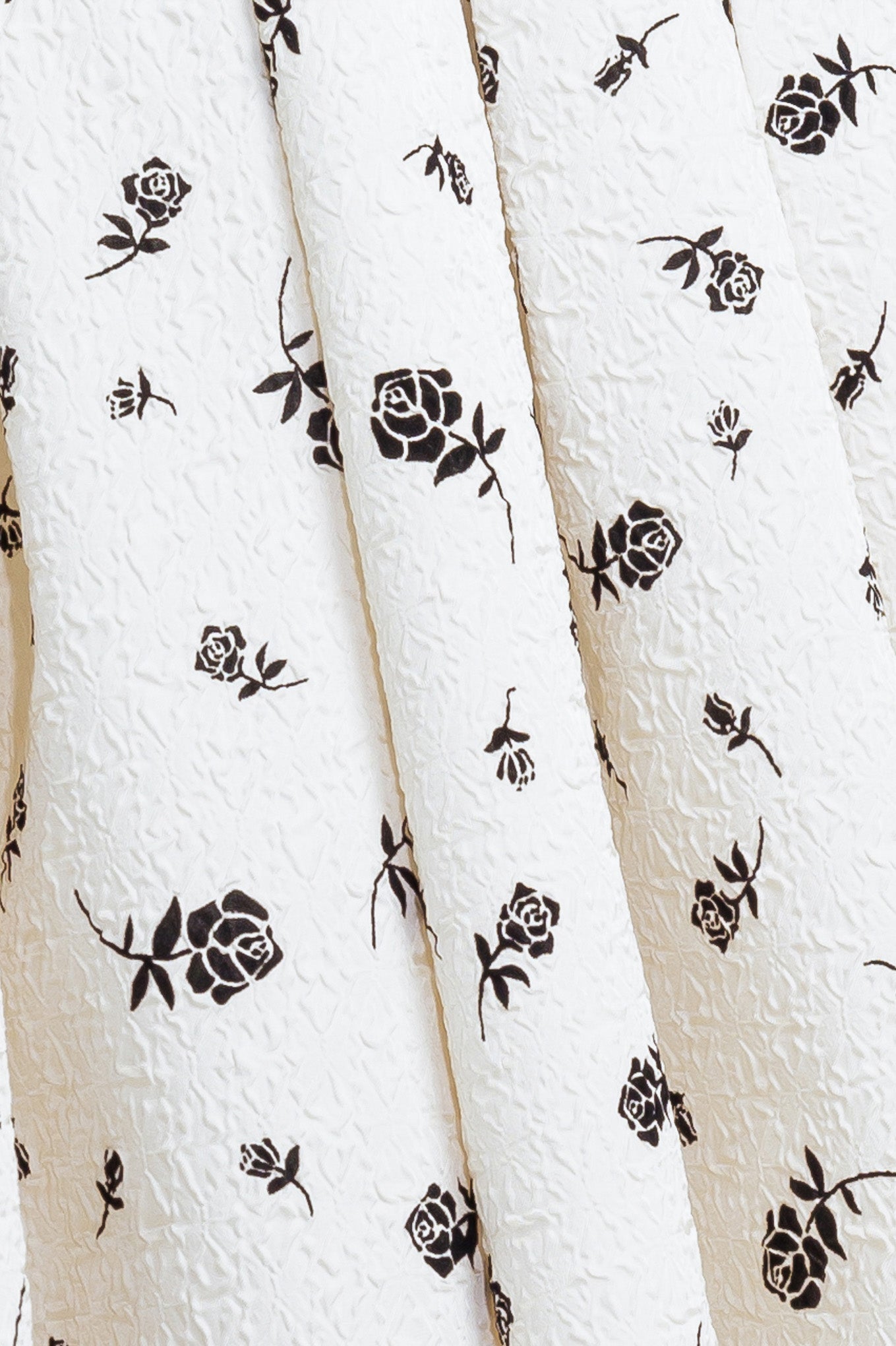 A printed textured woven midi dress featuring strapless neckline, contrasting belt, full skirt and back zipper closure