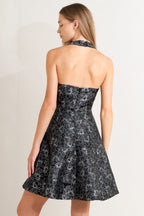 Back view of Mystic Hour woven jacquard mini dress in black and silver
