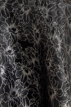 Close-up of metallic jacquard fabric detail on Mystic Hour mini dress