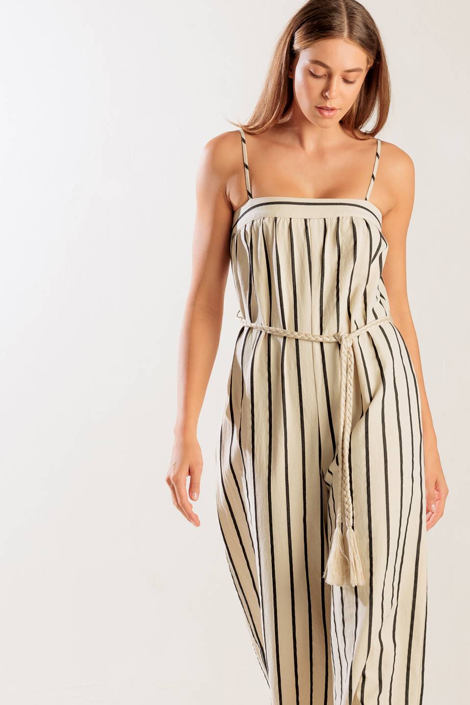 Woman wearing a striped dress on a white background