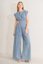RUNNING IN DENIM JUMPSUIT