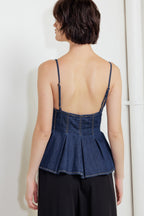 A lightweight denim cami top featuring front button down and peplum