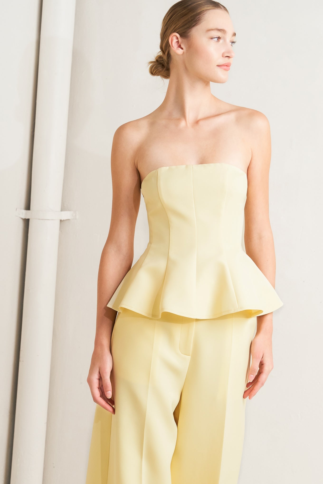 light yellow strapless peplum top