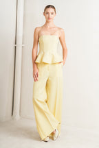light yellow strapless peplum top