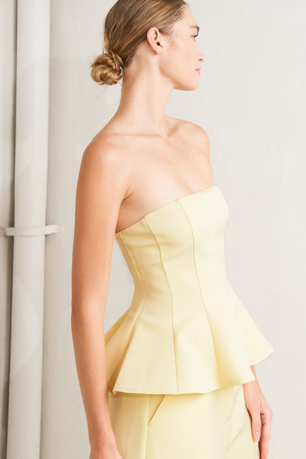 light yellow strapless peplum top