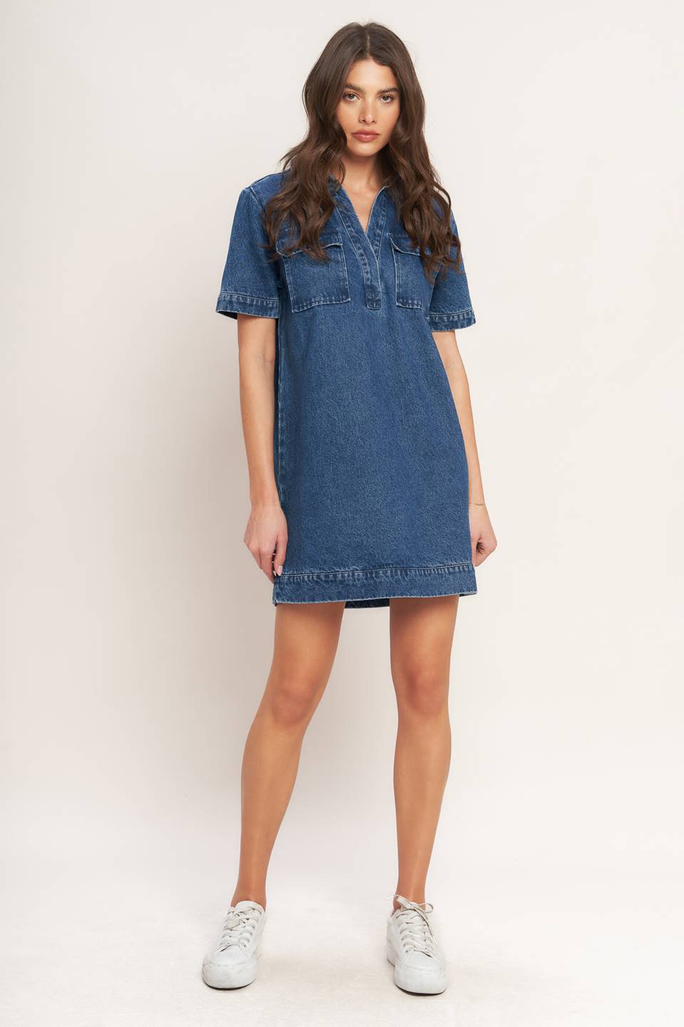 Woman wearing a blue denim mini dress
