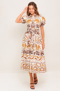 A printed woven midi dress featuring collar, short puff sleeve, button down, self sash and full skirt