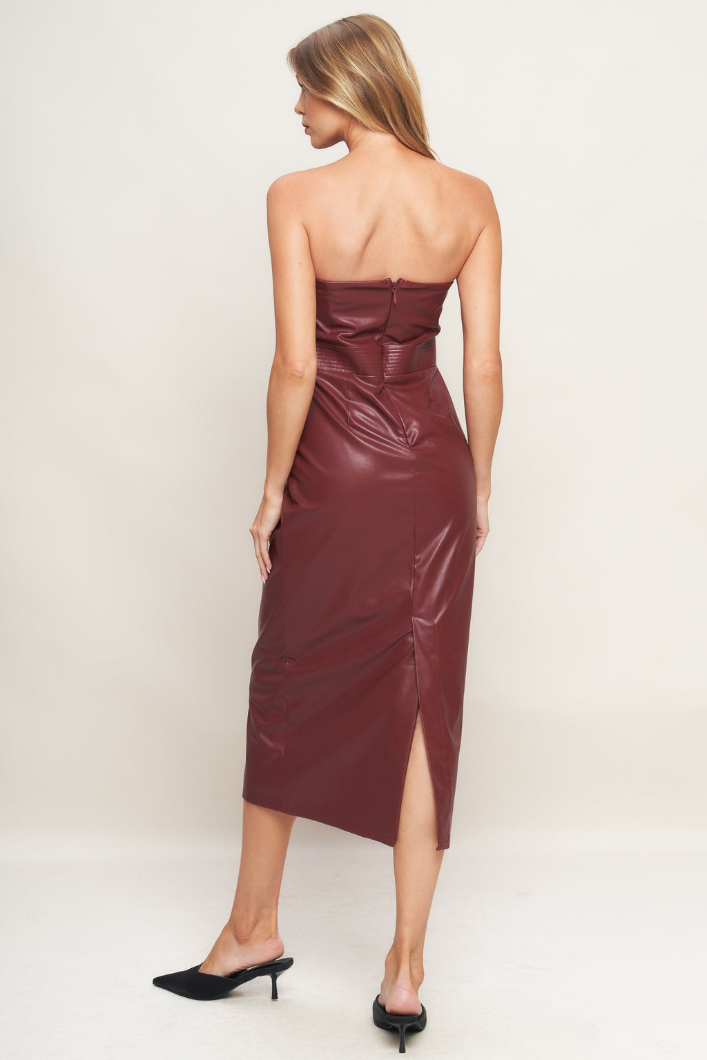A burgundy faux leather midi dress featuring wide neckline, sleeveless, pencil skirt, back slit and back zipper closure