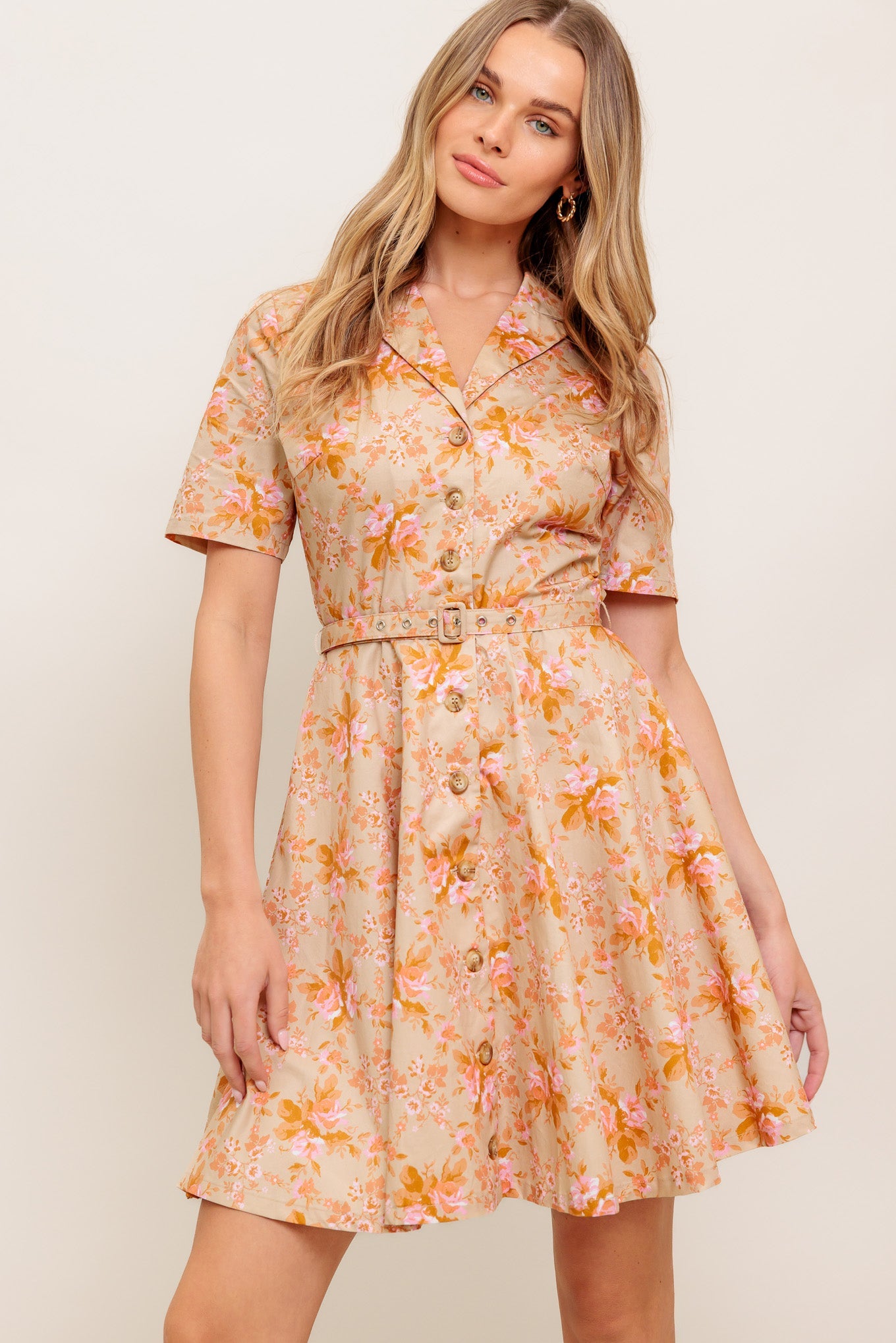 A printed woven mini dress featuring collar, button down, short sleeve, self-belt and circle skirt