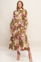 A printed woven midi dress featuring collar, long sleeve with cuff, front button-down closure, self-belt and full skirt