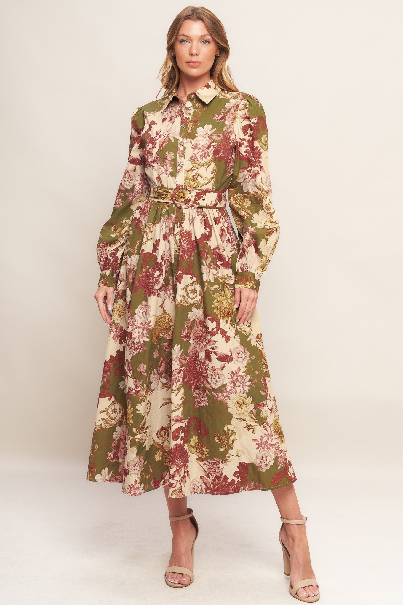 A printed woven midi dress featuring collar, long sleeve with cuff, front button-down closure, self-belt and full skirt