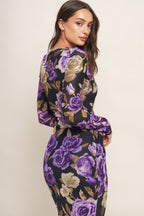 A printed power mesh midi dress featuring body contouring, round neckline, long sleeve and back neck button closure