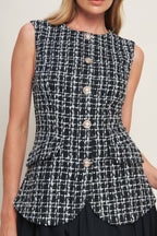 A tweed and solid woven mini dress featuring round neckline, sleeveless, front button down and flowy solid skirt.