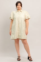 A floral textured woven mini dress featuring collar, short puff short and front button-down closure