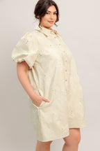 A floral textured woven mini dress featuring collar, short puff short and front button-down closure