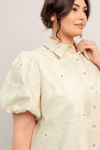 A floral textured woven mini dress featuring collar, short puff short and front button-down closure