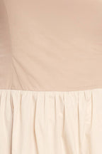 Color blocked midi dress with straight neckline, drop waist, full skirt, and smocked back