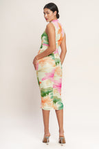 A colorful printed power mesh midi dress featuring tubular neckline, sleeveless, shirred side, body contouring and back zipper closure