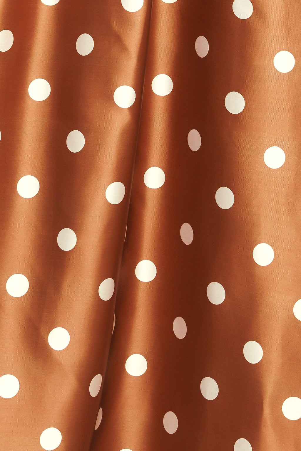 A polka dot printed woven full maxi skirt with size pocket and back zipper closure.