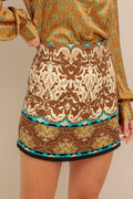 A printed woven skort with side zipper closure.