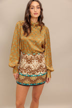 A printed woven skort with side zipper closure.