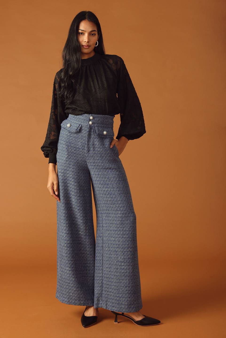A tweed pant featuring front closure, jewel button and pockets