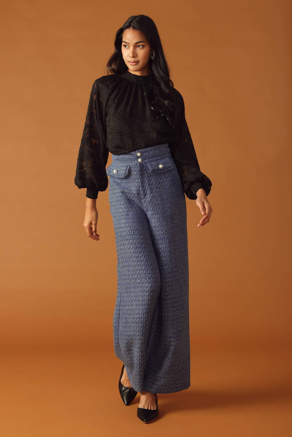 A tweed pant featuring front closure, jewel button and pockets