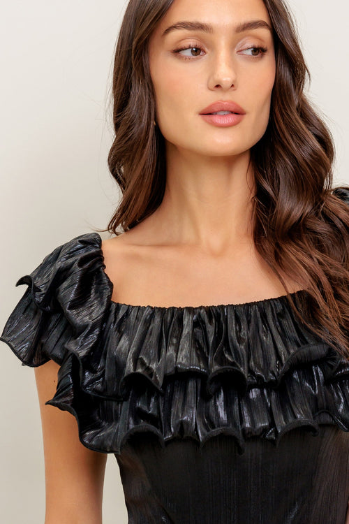 A black coated woven jumpsuit featuring off shoulder neckline, double layer pleated flounce, flare leg and back zipper closure