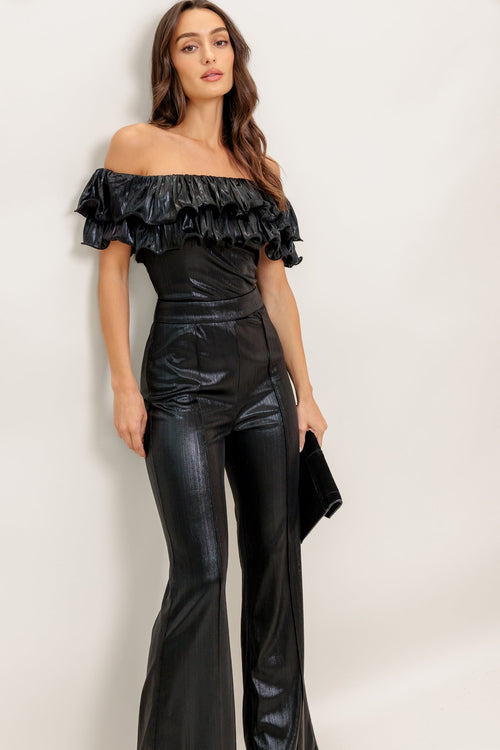 A black coated woven jumpsuit featuring off shoulder neckline, double layer pleated flounce, flare leg and back zipper closure