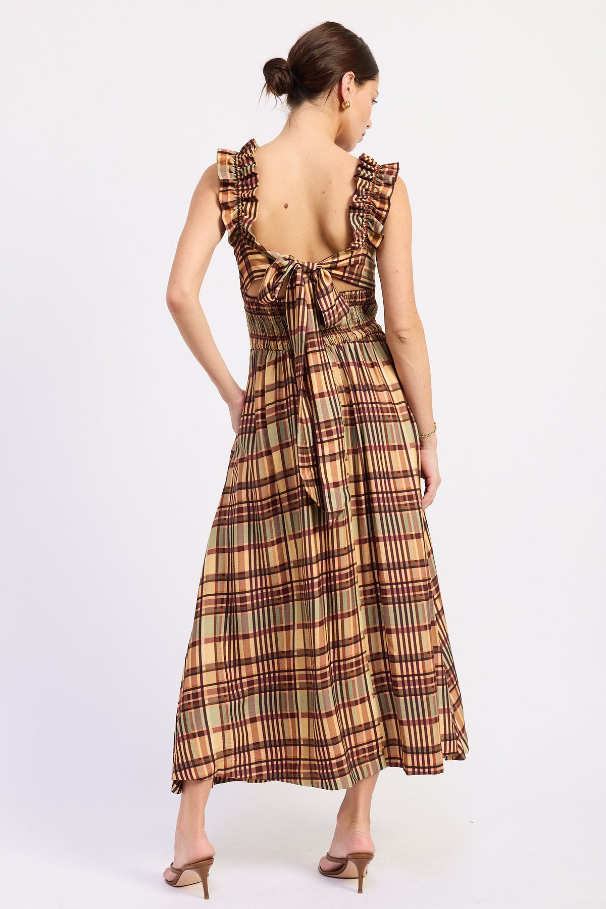 Model wearing the Kathleen almond plaid midi dress with a square neckline, ruffled straps, and a flared skirt.