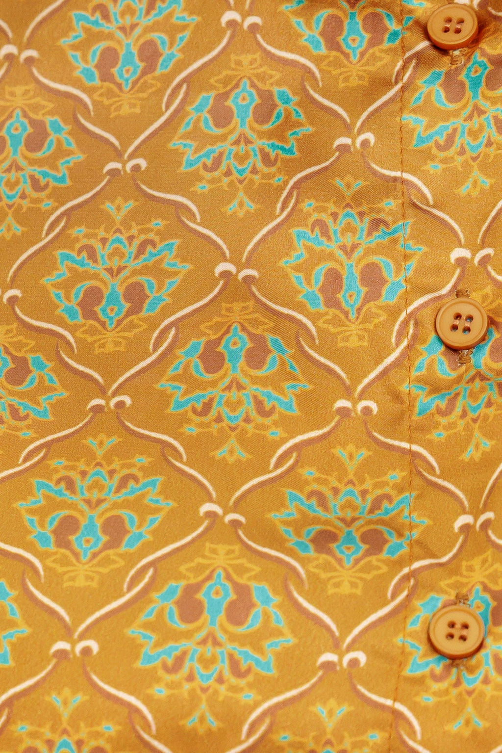 A printed woven top featuring collar, button down and long sleeve.