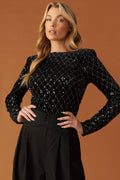 A black sequin bodysuit featuring round neckline, long sleeve and mesh bottom with snap closure.
