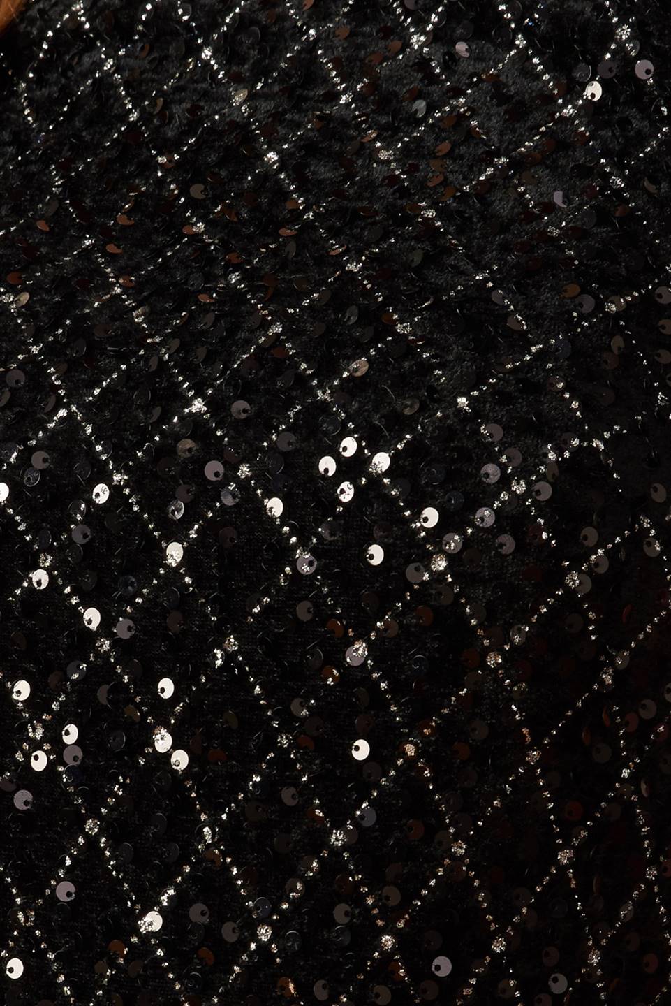 A black sequin bodysuit featuring round neckline, long sleeve and mesh bottom with snap closure.