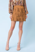 A faux suede mini skirt featuring three layers of fringe and a side zipper closure for a secure fit.
